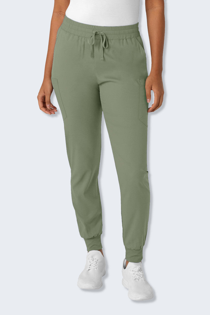 Sage Green Wink Boundless 5151 Scrub Pant, featuring a straight-leg design with a comfortable elastic waistband and drawstring. The pants include multiple pockets for practicality, crafted from soft, breathable, and sustainable recycled fabric for ease of movement. Supplied by Infectious Clothing Co.