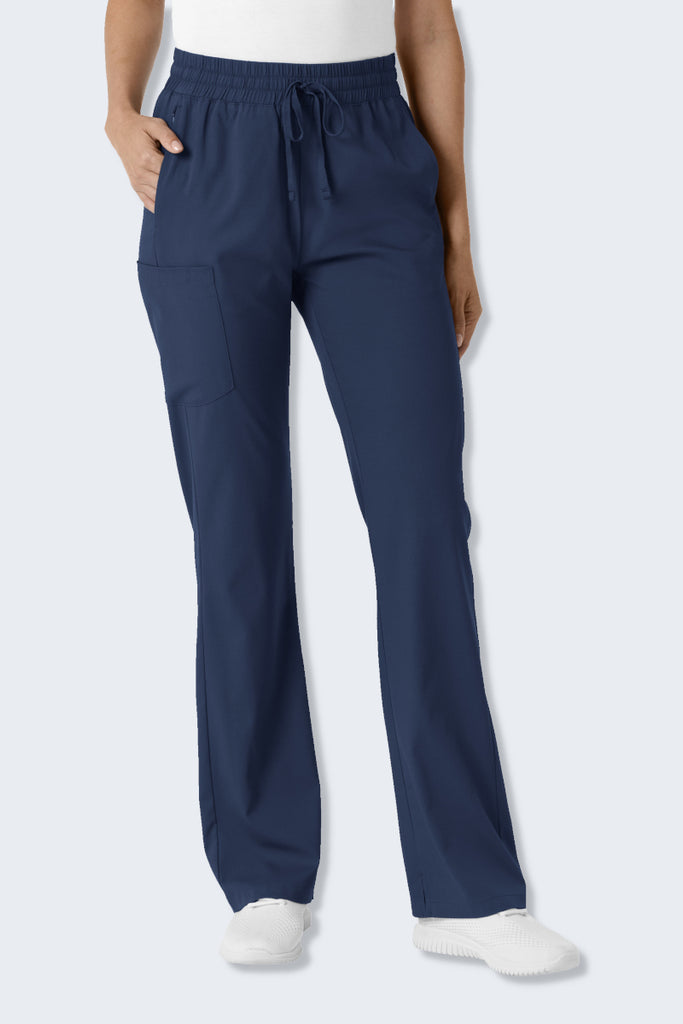 Navy WonderWink Boundless 5251 Women's Bootcut Scrub Pant, featuring a modern flare below the knees, a wide elastic waistband with drawstring, and multiple pockets including side, back, and cargo pockets. Made from soft, stretchy, and sustainable fabric for comfort and functionality throughout the workday. Supplied by Infectious Clothing Co.