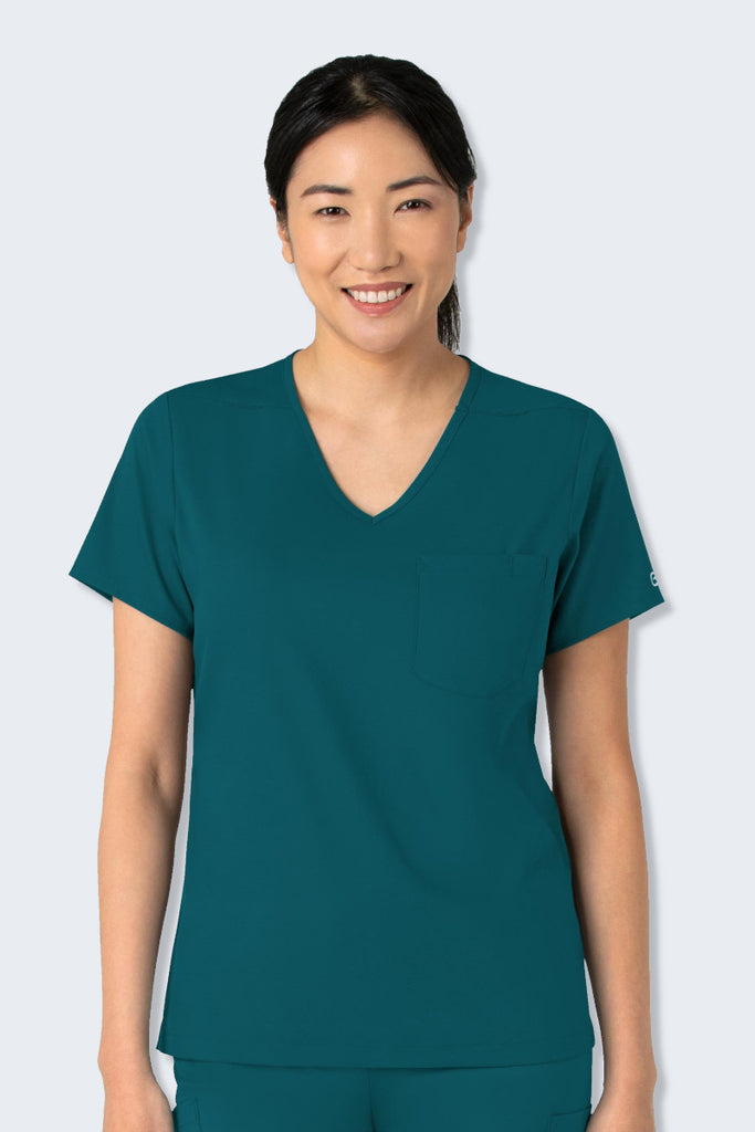 WonderWink Boundless 6151 Women's Scrub Top in Caribbean Blue, featuring a modern V-neck design with multiple pockets for practicality. Crafted from soft, breathable, and sustainable fabric for all-day comfort. Perfect for healthcare professionals. Supplied by Infectious Clothing Co.