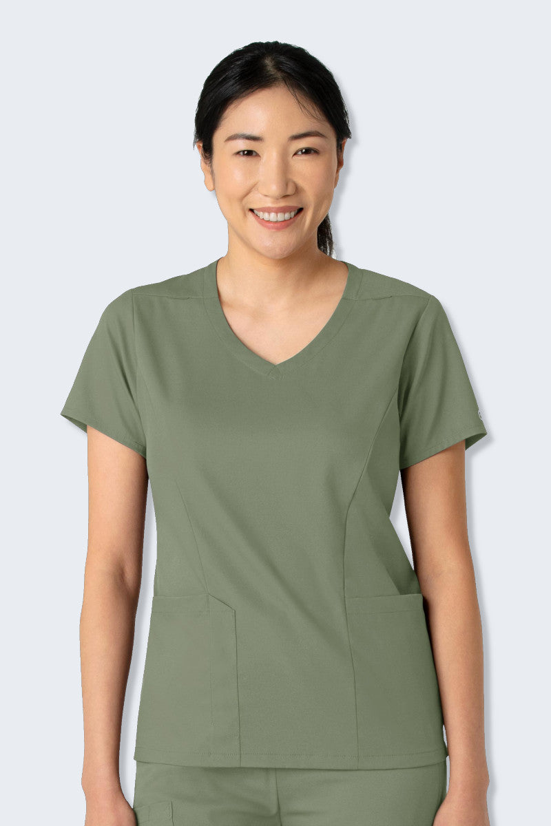 WonderWink Boundless 6251 Women's V-neck Scrub Top in Sage Green, featuring a classic neckline, curved hem, and practical top-loading pockets. Made from soft, stretchy, and sustainable fabric, designed for comfort and functionality throughout your workday. Supplied by Infectious Clothing Co.