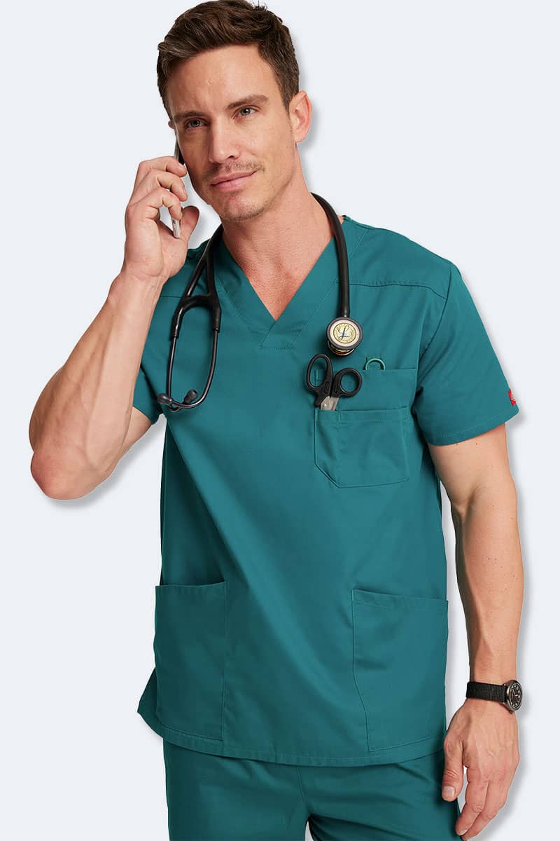 Male doctor wearing Dickies 81906 top in hunter green, ideal medical scrubs for men in Australia, featuring durable and professional scrubs clothing for healthcare professionals in Sydney and beyond.