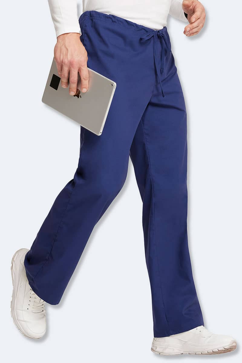 Healthcare professional wearing Dickies Unisex 83006 scrub pants in navy blue, showcasing durable and comfortable medical workwear for nurses and healthcare workers in Australia.