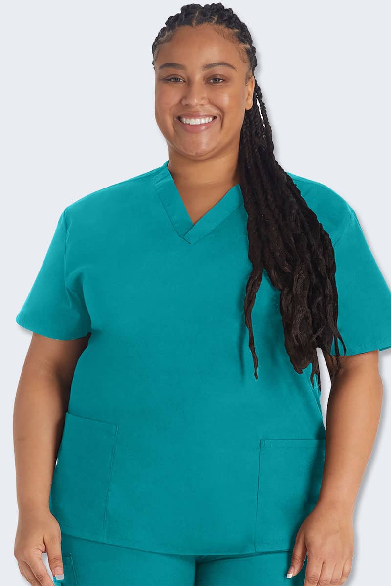 Plus-size healthcare professional wearing teal Dickies EDS nursing scrubs, representing real scrubs for real workers, showcasing comfort and durability.