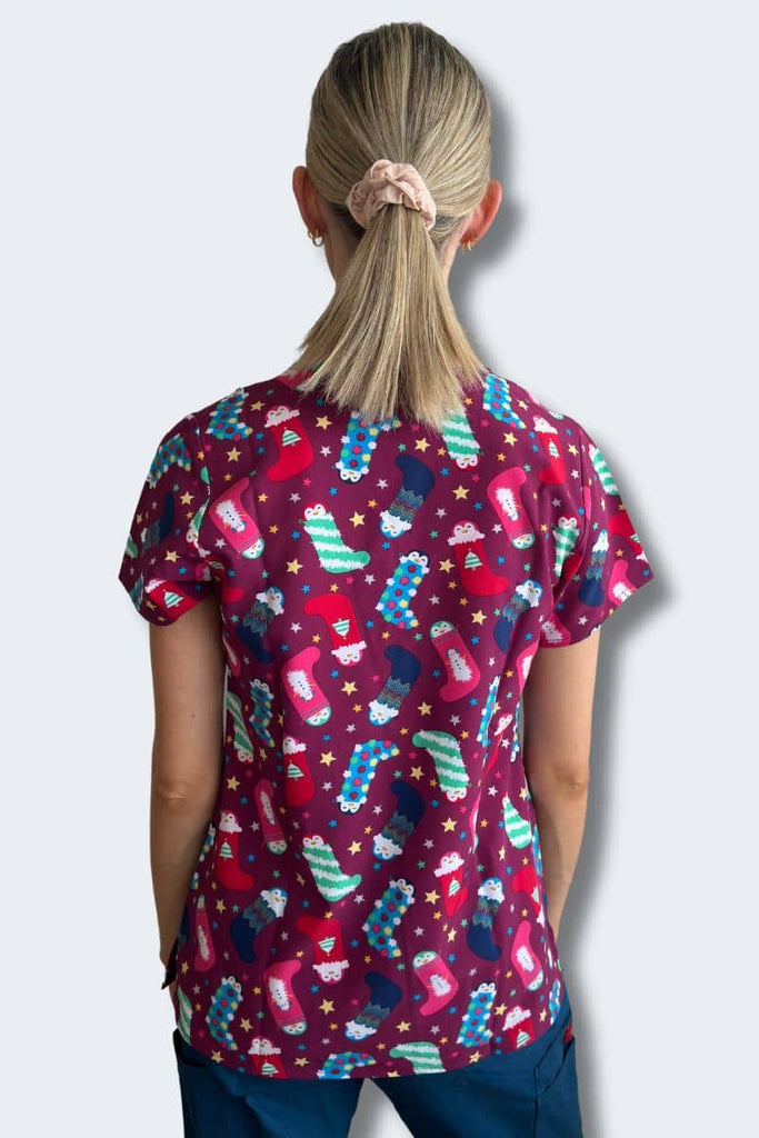 Penguin Pals Christmas Scrub Top Model Back View | Infectious Clothing Company