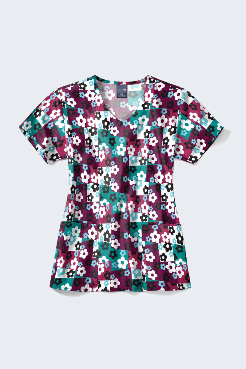 Add a pop of colour with this 'Skater Check' scrub top in its original vibrant hues! Featuring a playful floral patchwork design, perfect for a lively workday.